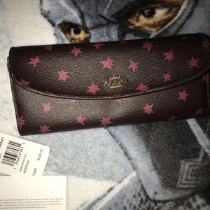 Coach wallet. Used. Has a lot of life left.